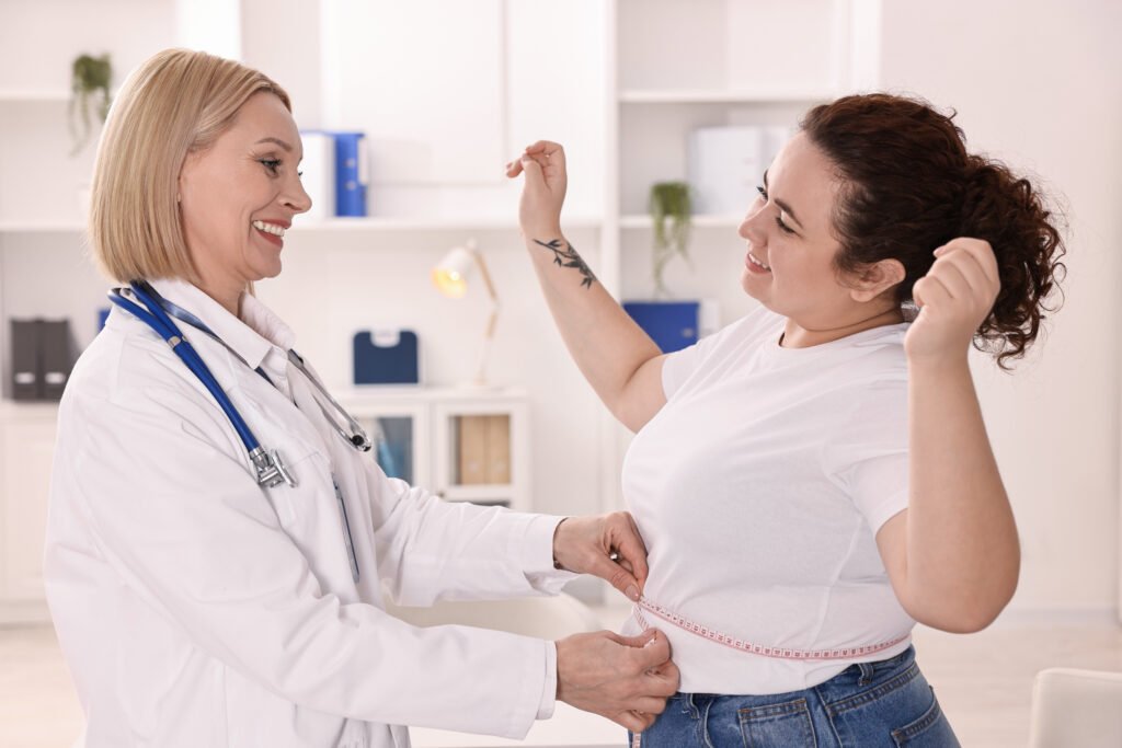 Patient celebrating progress with a ThinfastMD clinician